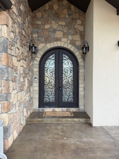 Iron double door stone patio