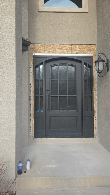 Iron door with sidelights under construction