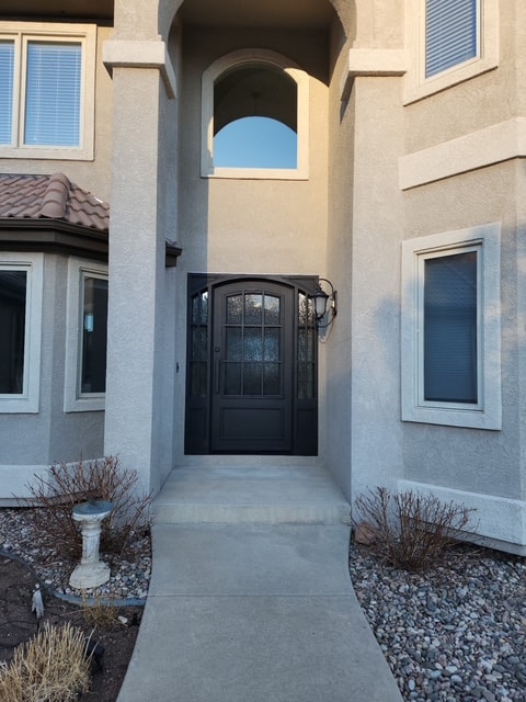 Iron door stucco home Colorado