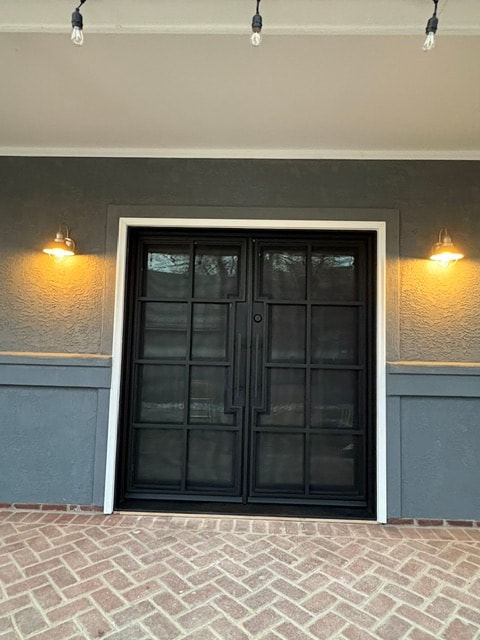Iron French doors evening exterior