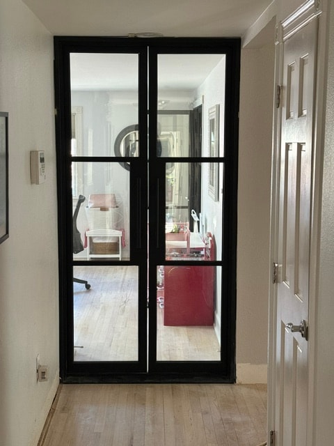 Black iron double doors hallway