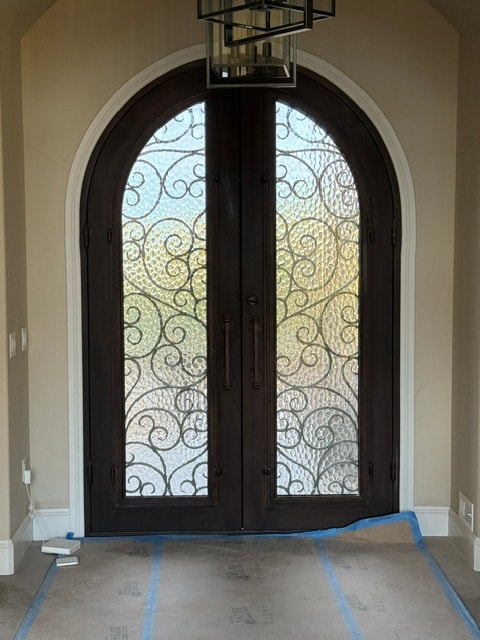 Arched iron double door interior view
