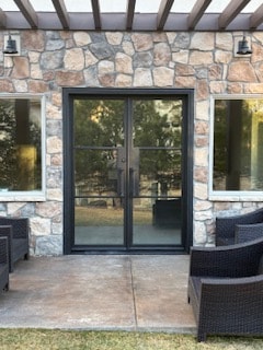 Iron patio doors stone wall
